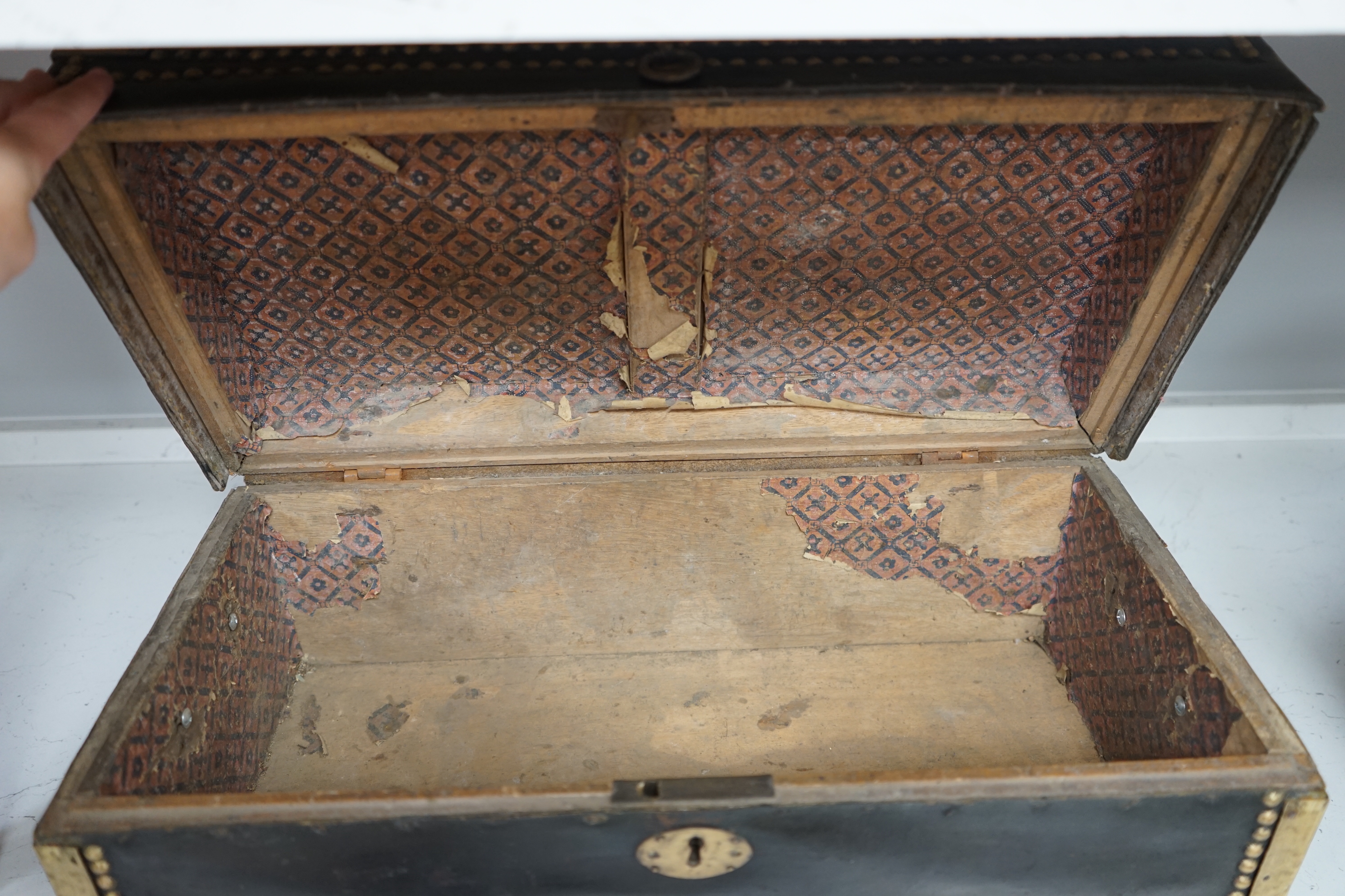 A 19th century leather and brass bound trunk with Avery Ltd applied brass plaque; 'Borough of Brighton', 54cm x 26.5cm x 22cm